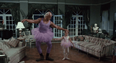 Man In Purple Tutu Holding Little Girl In Pink Tutu GIF