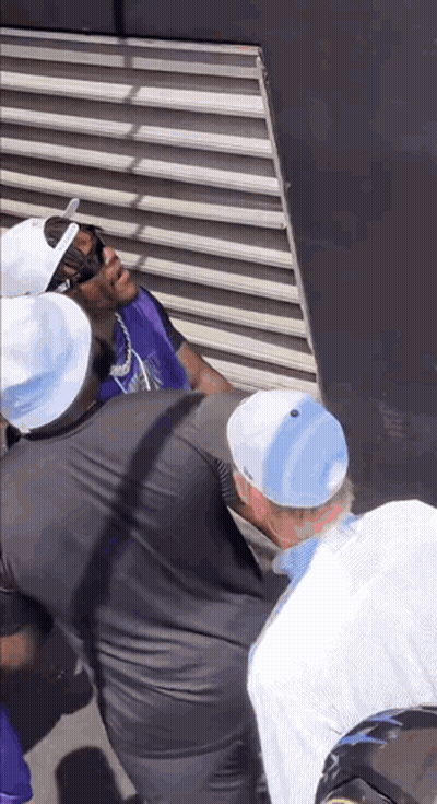 Man In Purple Vest And White Hat GIF