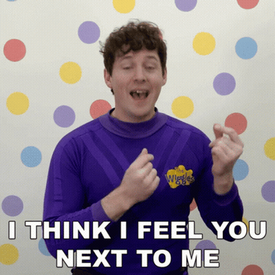 Man In Purple Wiggles Shirt Says I Think I Feel You Next To Me GIF