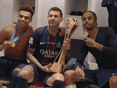 Man In Qatar Airlines Jersey Holding Trophy GIF