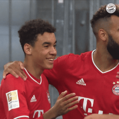 Man In Qatar Airways Jersey Hugging Another Man GIF