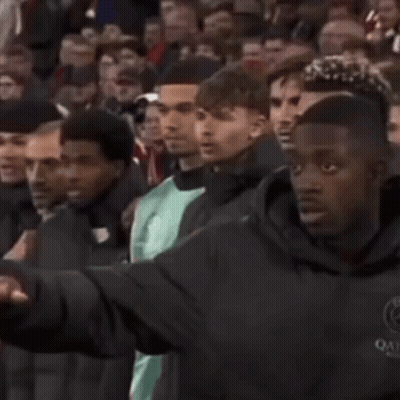 Man In Qatar Jacket Before Crowd GIF
