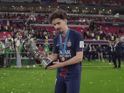 Man In Qatar Jersey Holding Trophy GIF
