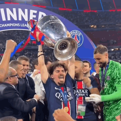 Man In Qatar Jersey Holding Trophy GIF