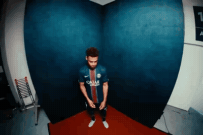 Man in Qatar Jersey Standing in Corner