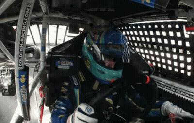 Man in Race Car with Goldfish Racing Sticker