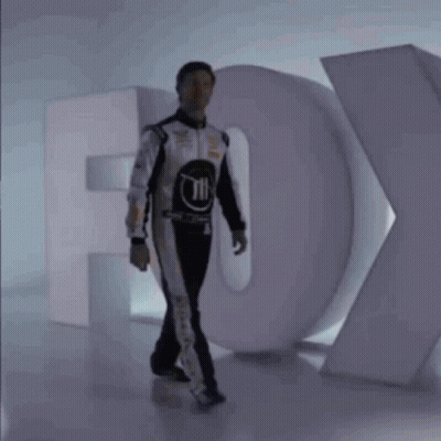 Man In Race Suit And Fox Logo GIF