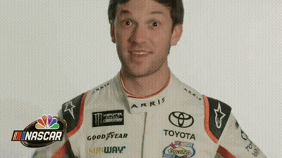 Man In Racing Suit At NBC NASCAR Logo GIF