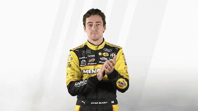 Man In Racing Suit Clapping GIF