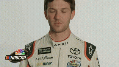 Man In Racing Suit Making Funny Face GIF