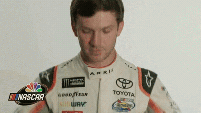 Man In Racing Suit NASCAR Sign GIF