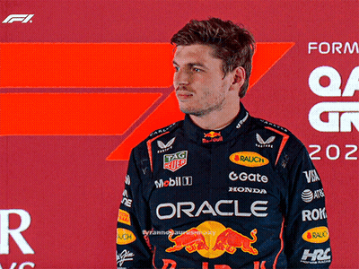 Man In Racing Suit Saying Oracle GIF