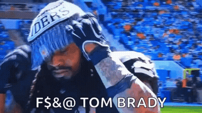 Man In Raiders Hat And Gloves Standing On Field GIF
