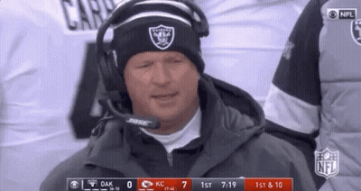 Man In Raiders Hat And Headphones On Sidelines GIF