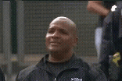 Man In Raiders Jacket Eyes Closed Looking At Camera GIF