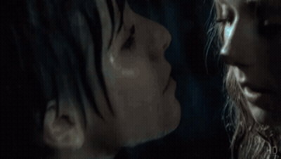 Man In Raiders Shirt Next To Man In Blue Shirt GIF
