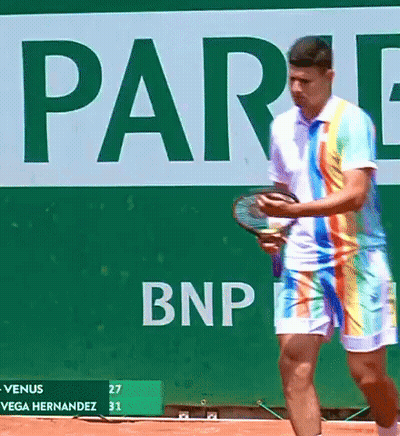 Man In Rainbow Outfit Holding Tennis Racquet BNP Sign GIF