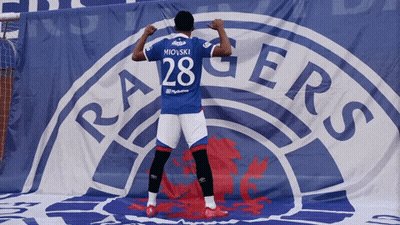 Man In Rangers Jersey In Front Of Banner GIF