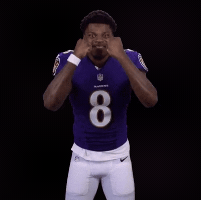 Man in Ravens Jersey Flexing Muscles