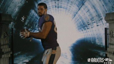 Man In Ravens Jersey Holding Football In Tunnel GIF