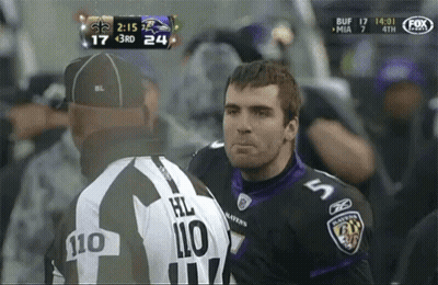 Man In Ravens Jersey Talking To Another Man GIF