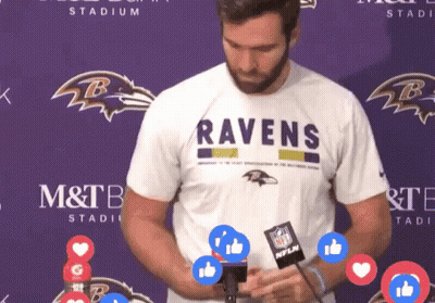 Man In Ravens Shirt In Front Of M&T Bank Stadium GIF