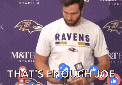 Man In Ravens Shirt In Front Of Purple Wall GIF
