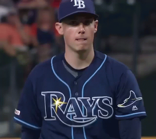 Man In Rays Jersey And Hat Looking At Camera GIF