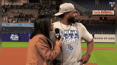 Man in Rays October Shirt Being Interviewed