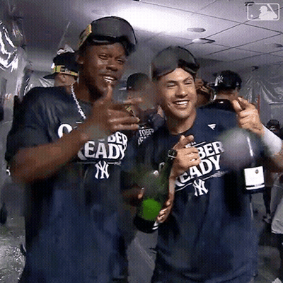 Man In Ready Shirt Holding Champagne GIF
