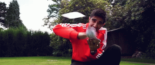 Man In Red Adidas Jacket Throwing Frisbee GIF
