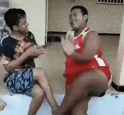 Man In Red Adidas Jersey Sitting GIF