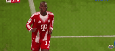 Man In Red Adidas Shirt Lifting Shirt On Soccer Field GIF