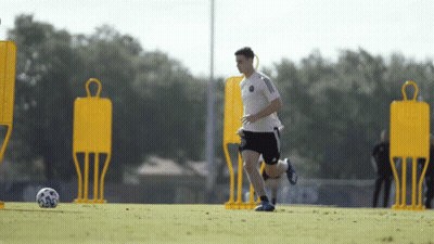 Man In Red Adidas Shirt Waving GIF