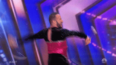 Man In Red And Black Dancing With NBC Logo GIF