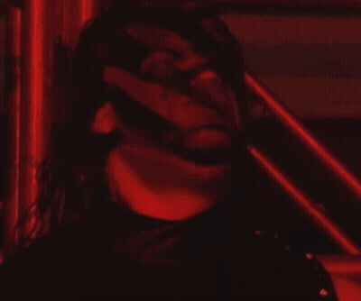 Man In Red And Black In Wrestling Ring With Pentagram GIF