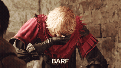 Man In Red And Black Outfit Covering Face Saying Barf GIF