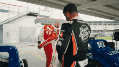 Man In Red And Black Racing Suit Number 35 GIF