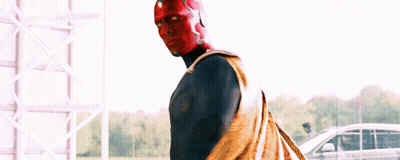 Man In Red And Blue Superhero Costume In Front Of Car GIF
