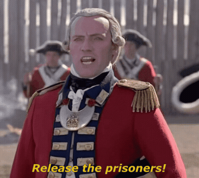 Man In Red And Blue Uniform Saying Release The Prisoners GIF