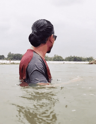 Man In Red And Grey Shirt In Water GIF