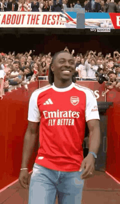 Man In Red And White Emirates Fly Better Jersey Walking Down Tunnel GIF