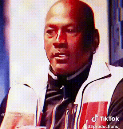 Man In Red And White Jacket Holding Drink Making Face GIF