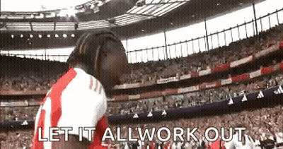 Man In Red And White Jersey Standing In Stadium GIF