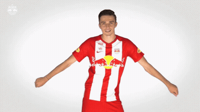 Man In Red And White Jersey With Red Bull Logo GIF