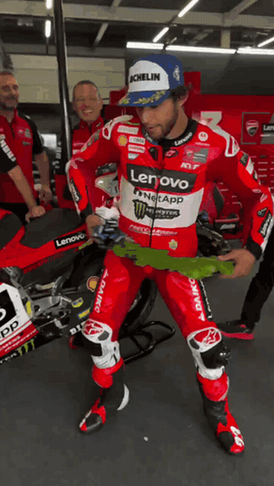 Man In Red And White Lenovo Monster Energy Racing Suit GIF