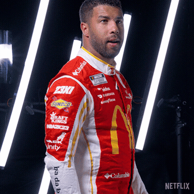 Man In Red And White McDonald's Racing Suit GIF