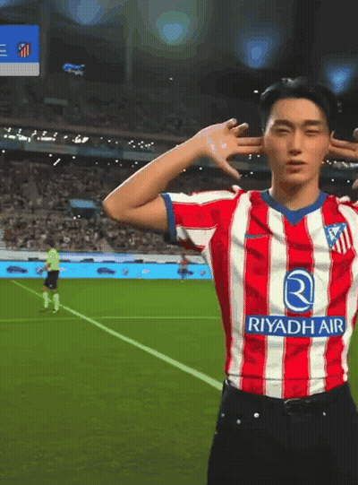Man In Red And White Riyadh Air Soccer Jersey GIF