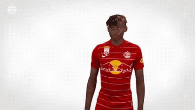 Man In Red And White Striped Jersey With Red Bull GIF