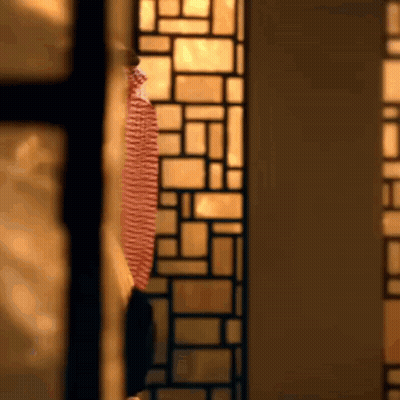 Man In Red And White Striped Shirt At Stained Glass Window GIF